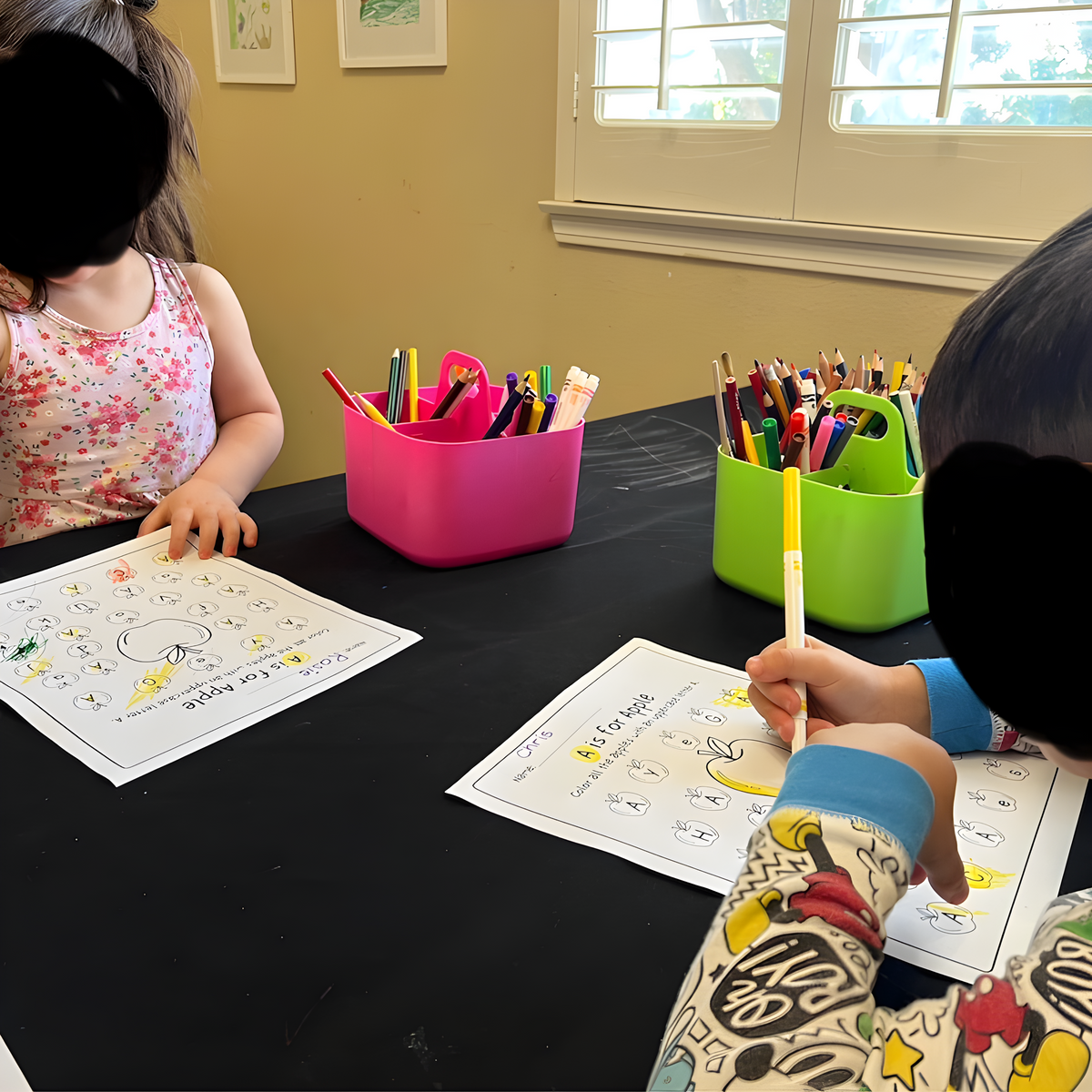 Children using Sproutly printable worksheets at a learning table