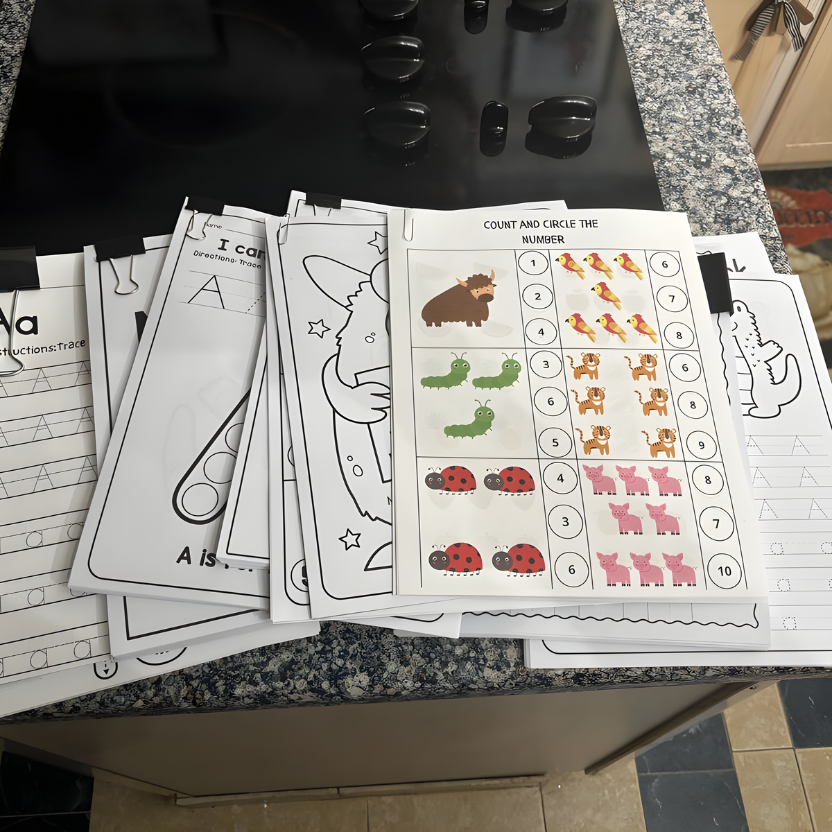 Prepared preschool worksheets including counting and tracing activities